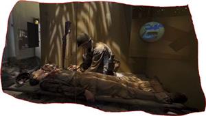 A Navy Corpsman saves a life on the battlefield. 